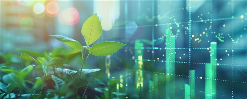 A green leaf growing with financial stock market graphs in the background, symbolizing sustainable investment.
